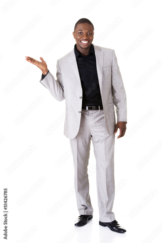 Businessman presenting something on his palm Businessman presenting something on his palm