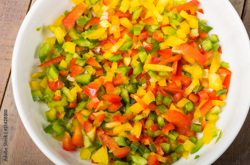 Bowl of freshly diced red yellow peppers Bowl of freshly diced red yellow peppers