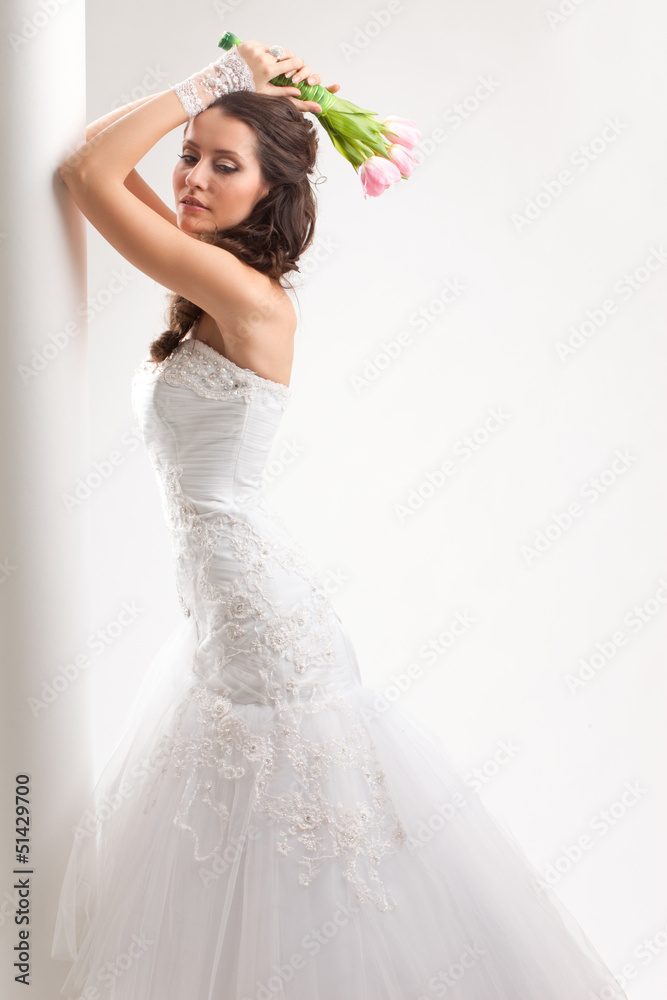 beautiful bride standing near white column beautiful bride standing near white column