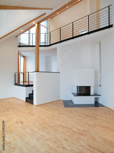 Empty livingroom with open-earth fireplace photo