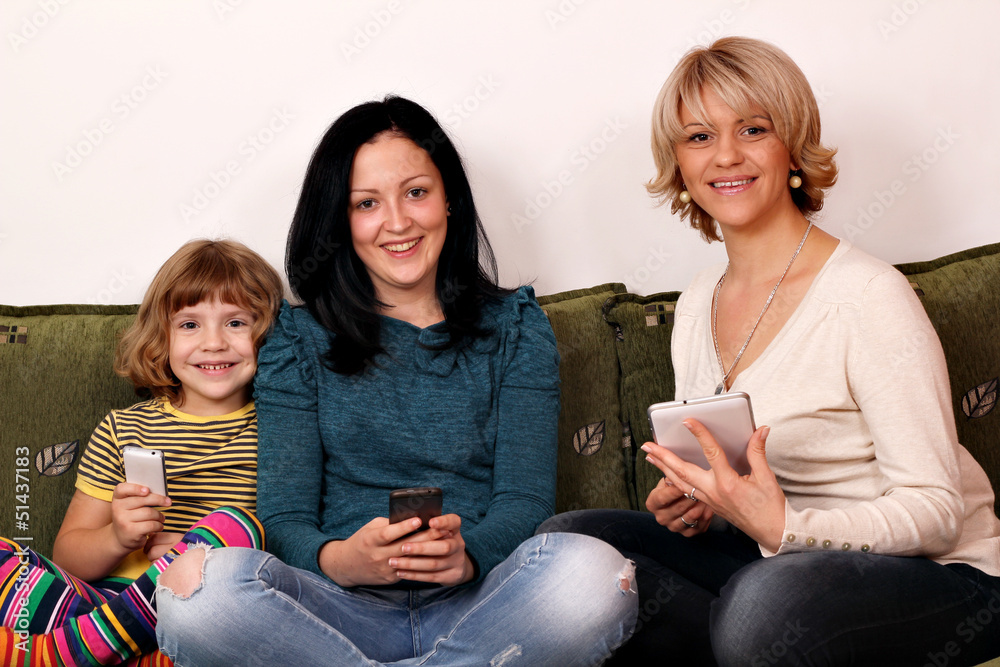 little girl teenage girl and woman play with smart phones and ta little girl teenage girl and woman play with smart phones and ta