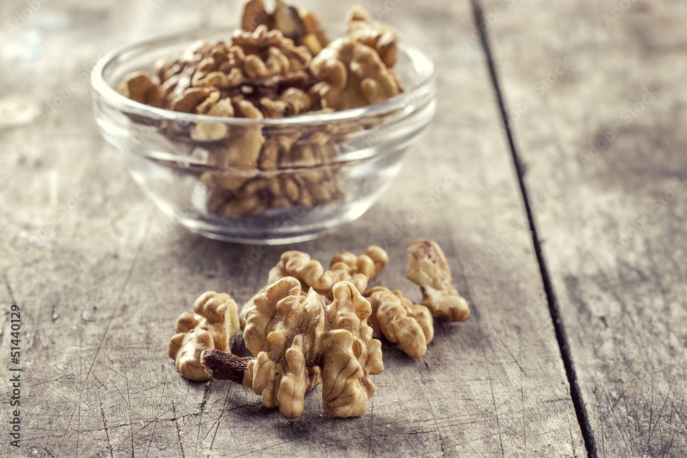 walnuts on wooden table walnuts on wooden table