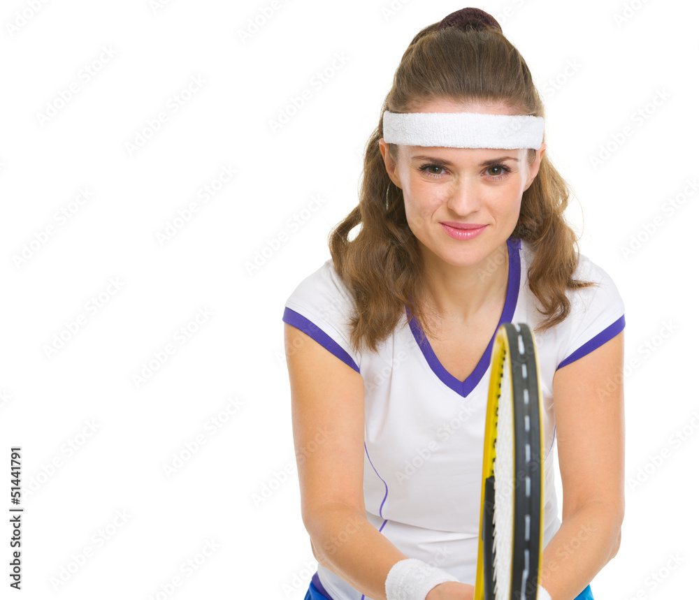 Smiling female tennis player in stance Smiling female tennis player in stance