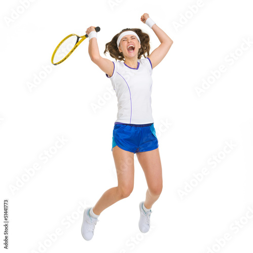 Happy female tennis player jumping © Alliance