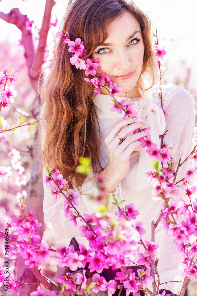 pretty girl in pink blossom garden pretty girl in pink blossom garden