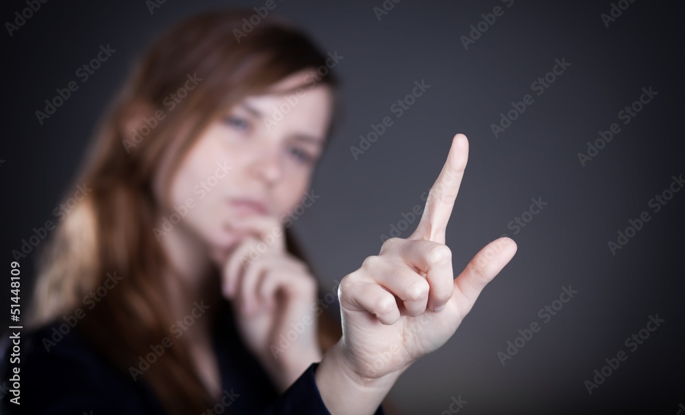 Woman's hand, one finger pointing something Woman's hand, one finger pointing something
