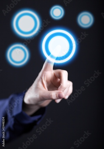 Woman's hand pushing the button on touch screen