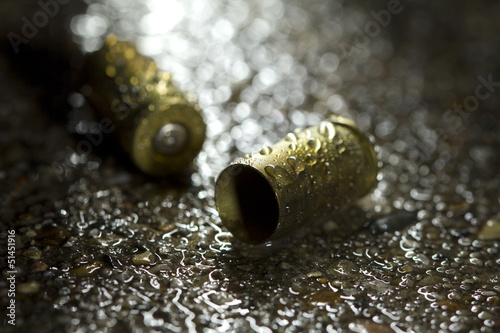 Bullets on ground on rainy day © Burlingham