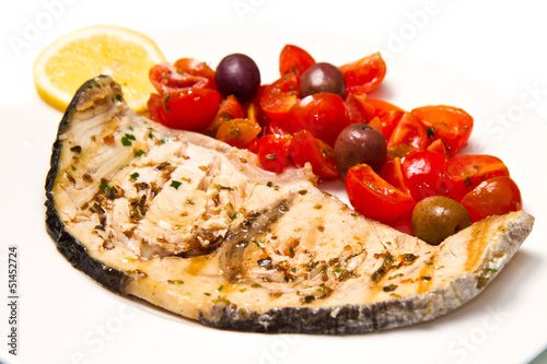 pesce spada con pomodorini e olive nere photo
