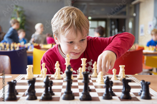Young chess player at a tournament photo