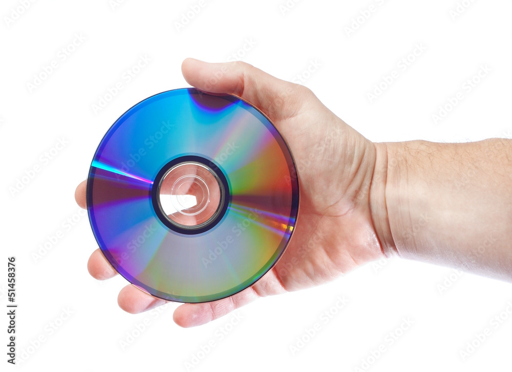 The man in the hand lerzhit cd drive. Close-up on a white backgr The man in the hand lerzhit cd drive. Close-up on a white backgr