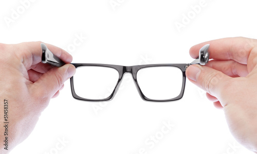 A man wearing glasses to improve vision. On a white background.