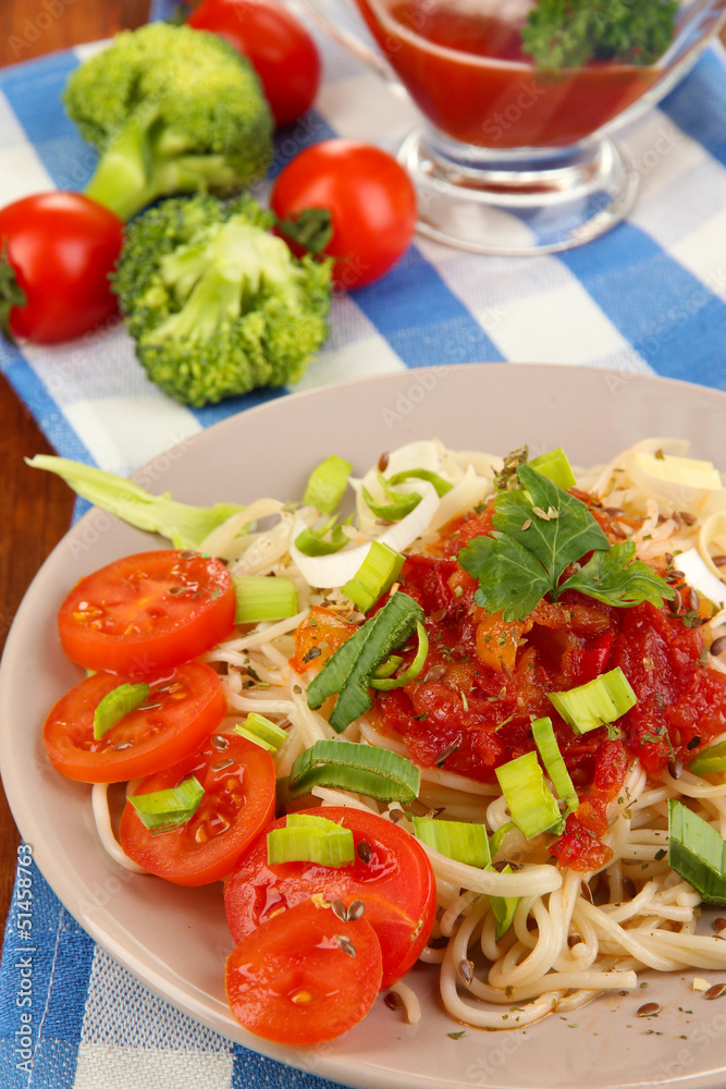 Tasty spaghetti with sauce and vegetables