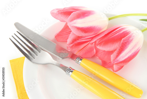 Festive dining table setting with tulips isolated on white