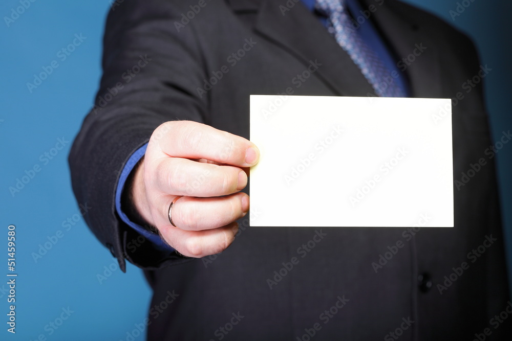 Close up of business note card in male hand Close up of business note card in male hand