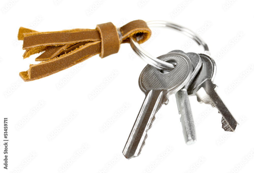 Key with leather trinket isolated on white Key with leather trinket isolated on white