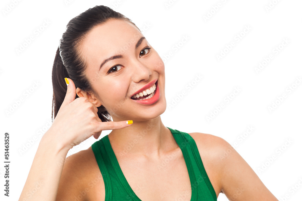 Pretty asian girl gesturing mock call Pretty asian girl gesturing mock call