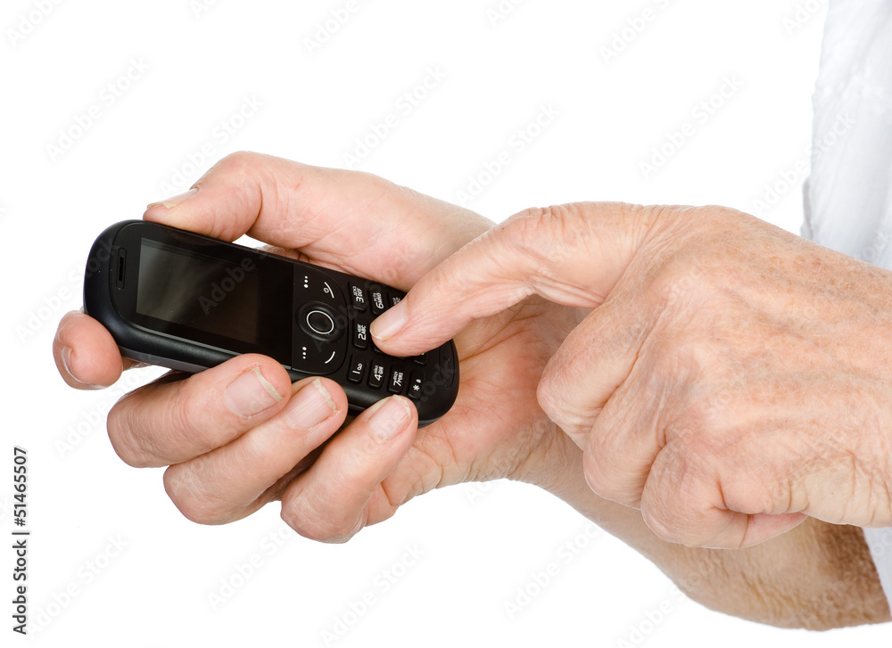 hands of the elderly person dial number on the cell phone hands of the elderly person dial number on the cell phone