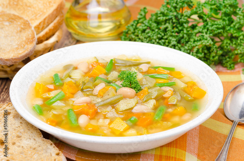 vegetable minestrone with white beans and toast horizontal © cook_inspire