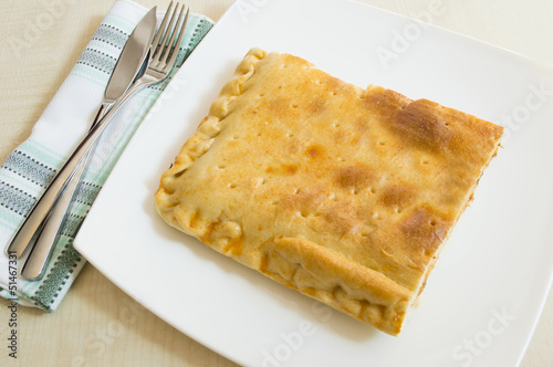 empanada dish from Galicia Spain with various ingredients inside