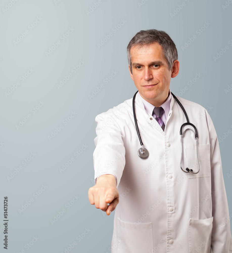 Middle aged doctor gesturing with copy space Middle aged doctor gesturing with copy space