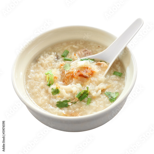 Congee round bowl and spoon on white background.