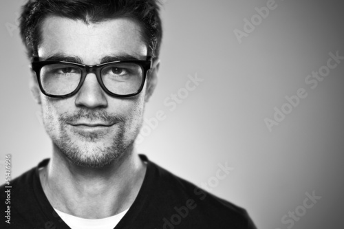 Portrait of a normal boy with rimmed glasses