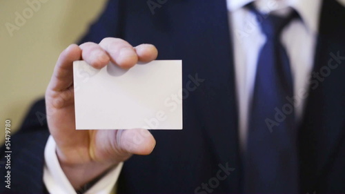 Businessman showing blank business card