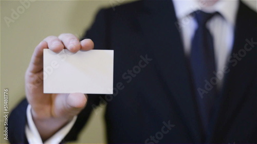 Businessman showing blank business card