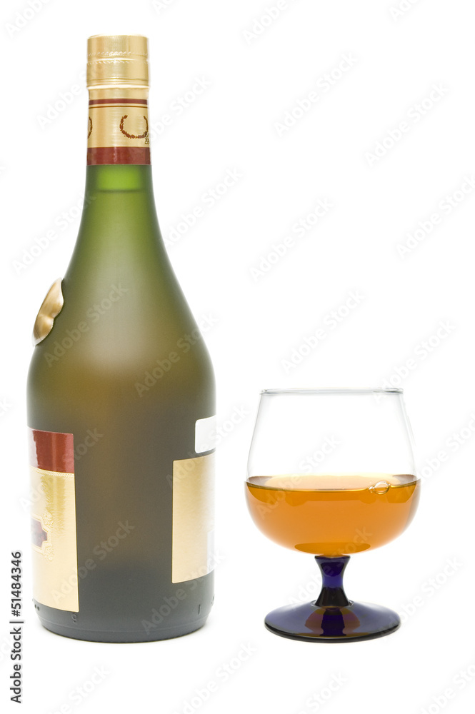 Cognac bottle and glass on white background Cognac bottle and glass on white background