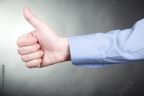 Man gesturing approval thumbs up sign
