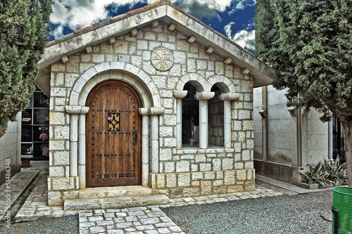 beautiful stone house in a cemetery © james633