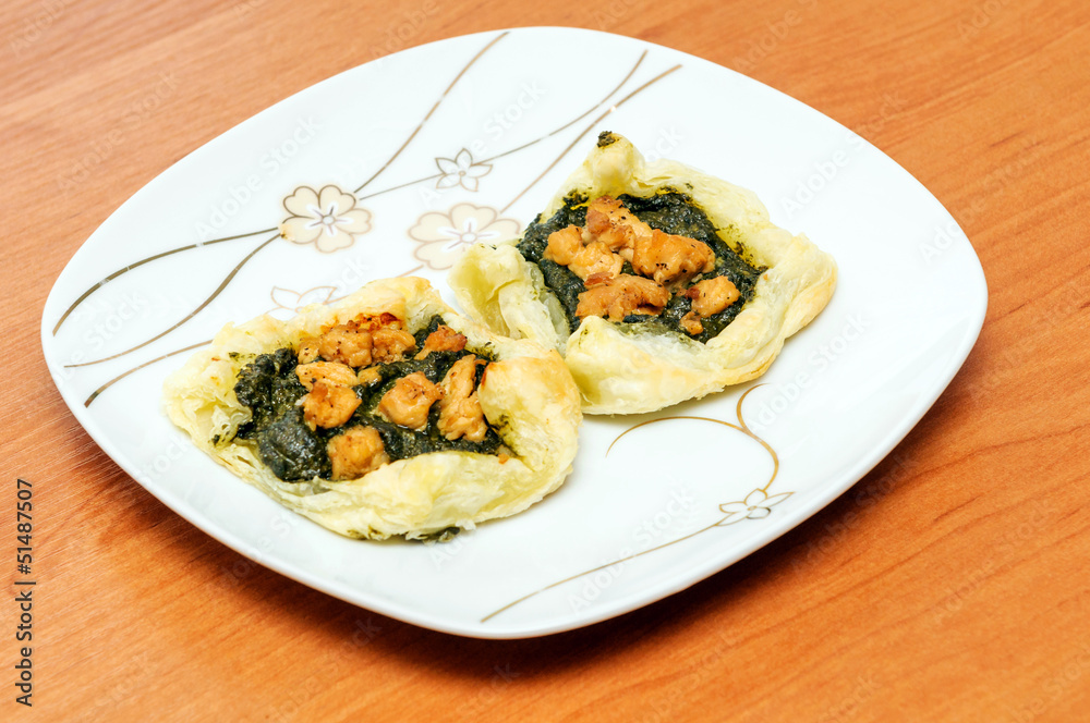 appetizer of puff pastry with spinach and chicken