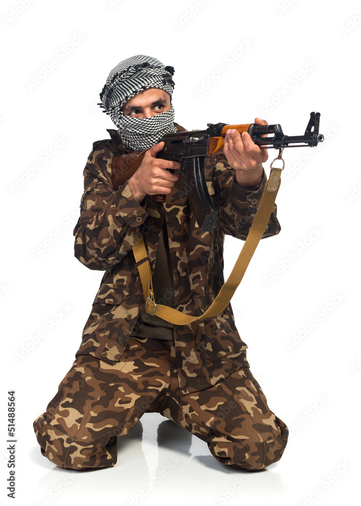 Terrorist with automatic gun on white background Terrorist with automatic gun on white background