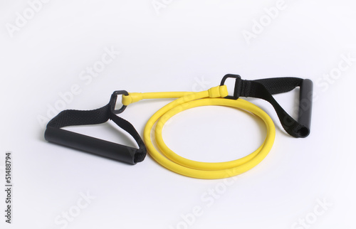 Yellow resistance strength training bands over white background