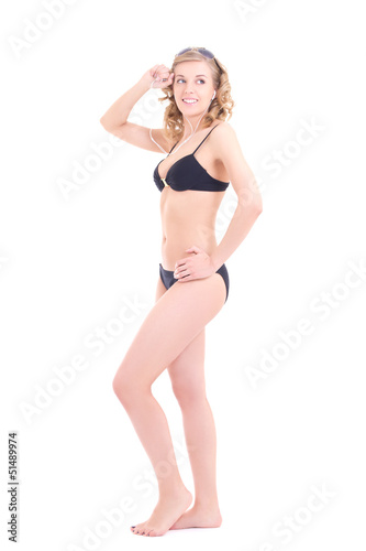beautiful curly blonde in black swimsuit listening music
