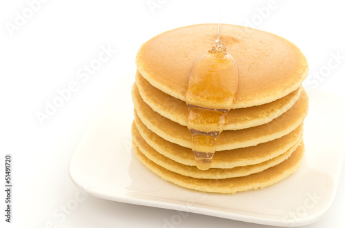 Pouring Honey to Pancakes
