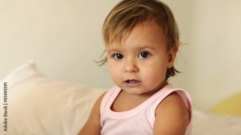 Adorable small curios girl while bedtime at evening Adorable small curios girl while bedtime at evening