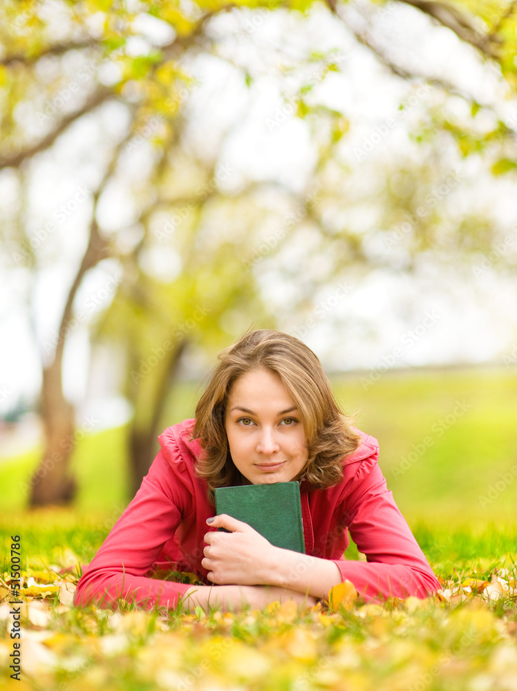 autumn woman on leafs with the book autumn woman on leafs with the book