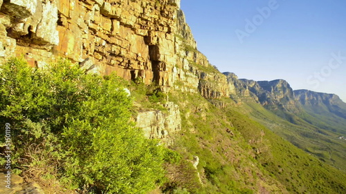 Green grassy rocky hill, table mountain, south africa