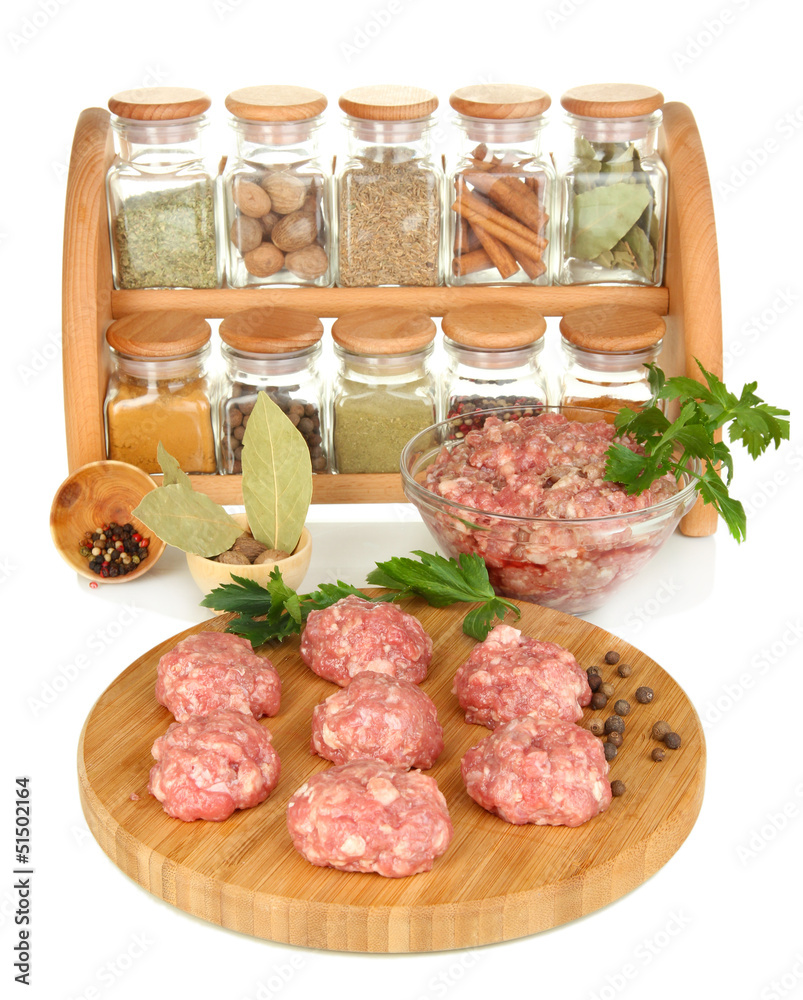Raw meatballs with spices isolated on white Raw meatballs with spices isolated on white