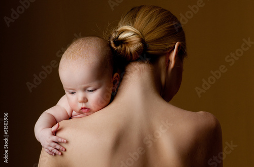 young mother holding a baby in her arms