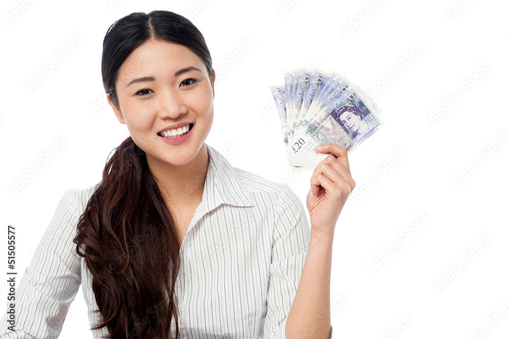 Pretty woman holding a fan of currency notes Pretty woman holding a fan of currency notes