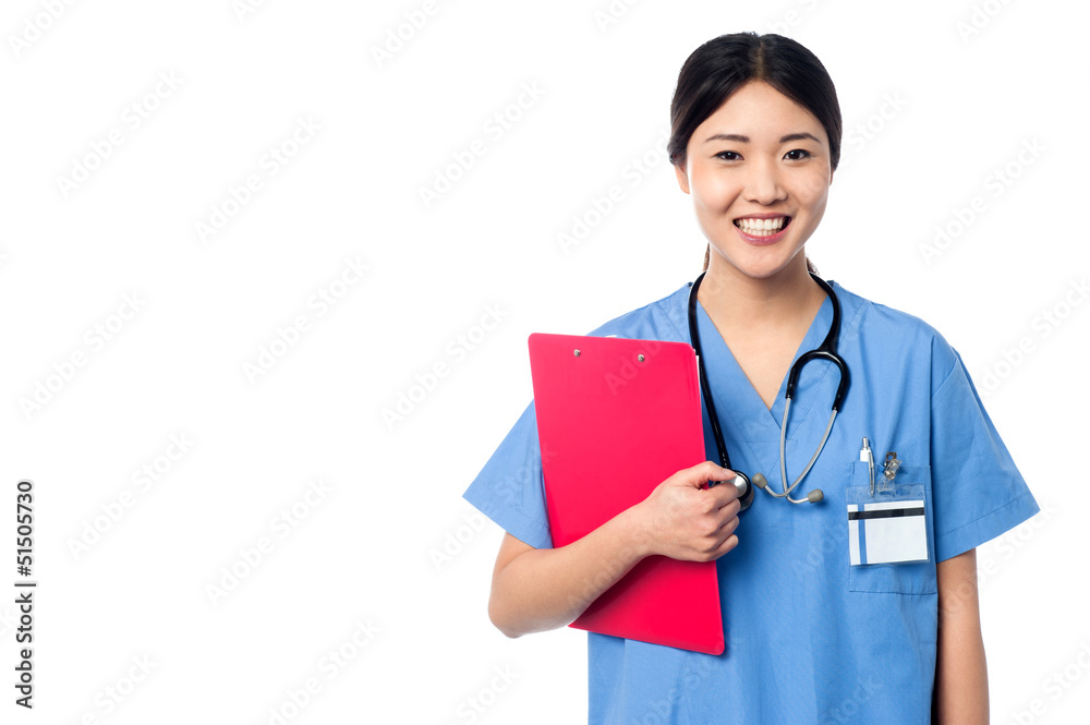 Lady doctor holding clipboard and posing Lady doctor holding clipboard and posing