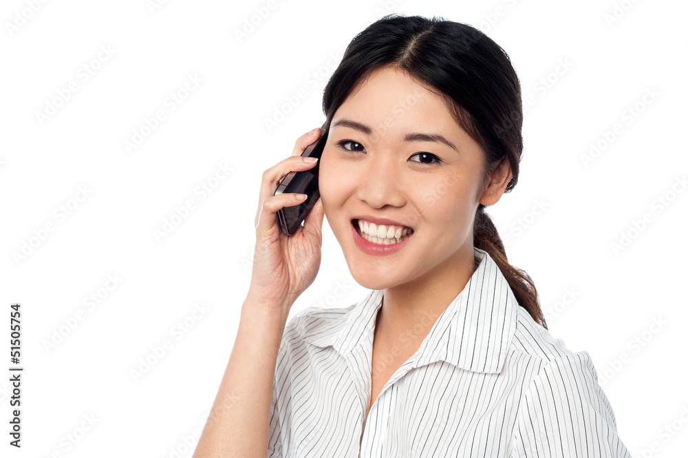 Young girl speaking over cellphone Young girl speaking over cellphone