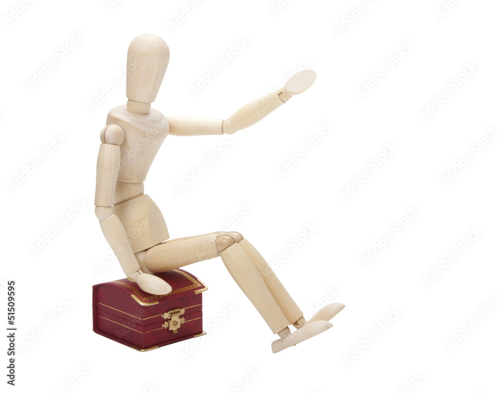 Wooden dummy with gift box, isolated on a white background Wooden dummy with gift box, isolated on a white background