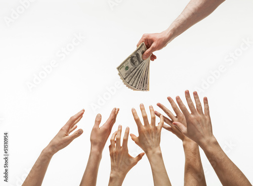 Many hands reaching out for money
