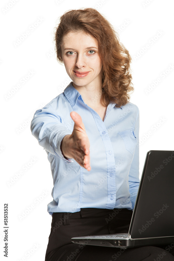 Young businesswoman with a laptop offering handshake to you Young businesswoman with a laptop offering handshake to you