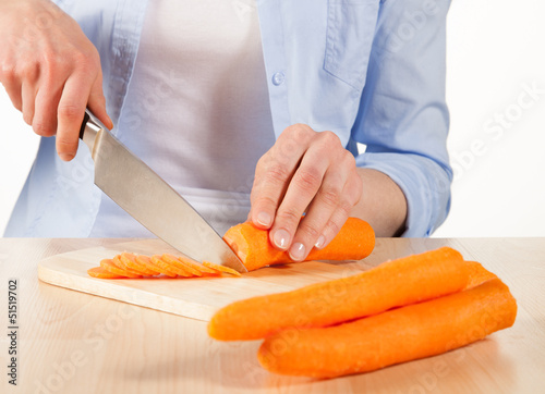 Salad preparation - cutting into pieces fresh carrot