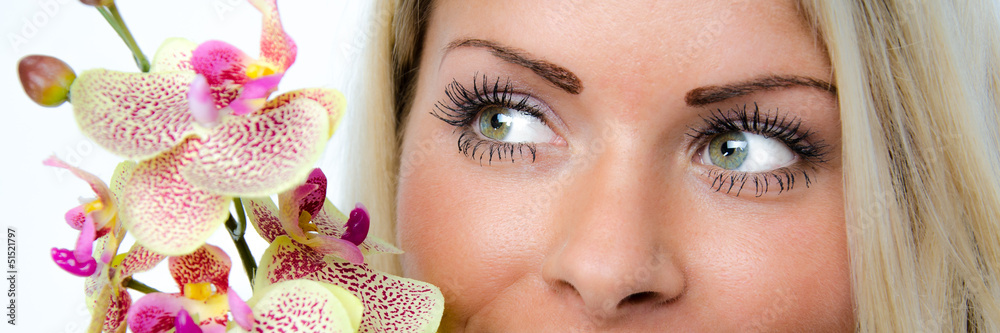Obraz premium schöne augen mit orchidee